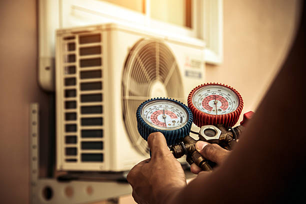 Professional Air Conditioning Service technician working in Louviers, CO